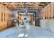 A spacious unfinished garage with an open concept to an additional garage with games and high ceilings at 32217 Buffalo Park Rd, Evergreen, CO 80439
