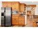 Kitchen featuring stainless steel appliances, wooden cabinetry, and an eat-in breakfast nook at 32217 Buffalo Park Rd, Evergreen, CO 80439