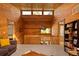 Loft area featuring wood beamed ceilings and access to multiple rooms at 32217 Buffalo Park Rd, Evergreen, CO 80439