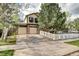 Charming two-story home with a two-car garage, well-manicured lawn, and a white picket fence at 1438 Stockton Dr, Erie, CO 80516