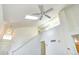 Bright interior showcasing a soaring ceiling, skylight, and staircase at 1438 Stockton Dr, Erie, CO 80516