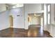 Spacious living room with hardwood floors, open layout, and access to the kitchen at 1438 Stockton Dr, Erie, CO 80516