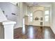 Spacious living room featuring a vaulted ceiling, hardwood floors, and a built-in entertainment center at 1438 Stockton Dr, Erie, CO 80516