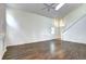 Bright living room with hardwood floors, a skylight, and a modern staircase at 1438 Stockton Dr, Erie, CO 80516