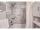 Modern bathroom featuring a tiled shower, bathtub, and built-in shelving at 1648 S Cole St # A2, Lakewood, CO 80228