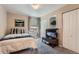 Bedroom with plush carpet, large windows, and a spacious closet at 1648 S Cole St # A2, Lakewood, CO 80228
