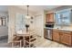 Cozy dining area with natural wood table set, and stainless steel dishwasher at 1648 S Cole St # A2, Lakewood, CO 80228