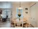 Bright dining area with a classic table set and view into the living room at 1648 S Cole St # A2, Lakewood, CO 80228