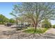 Condo exterior featuring well-maintained landscaping and ample parking at 1648 S Cole St # A2, Lakewood, CO 80228