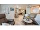 Open living area with views into the kitchen and dining space, great natural light at 1648 S Cole St # A2, Lakewood, CO 80228