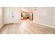 Open-concept living space with wood floors flowing into a well-equipped kitchen at 1648 S Cole St # A2, Lakewood, CO 80228