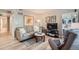 Inviting living room featuring wood floors, comfortable sofa and chair perfect for relaxation at 1648 S Cole St # A2, Lakewood, CO 80228