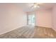 An airy Primary bedroom with carpeted floors and a sliding glass door at 1648 S Cole St # A2, Lakewood, CO 80228