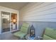 Inviting patio space with comfortable seating and a glimpse of the bedroom through the sliding glass door at 1648 S Cole St # A2, Lakewood, CO 80228