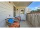 Cozy covered patio with seating and view of the courtyard; Unit A2 at 1648 S Cole St # A2, Lakewood, CO 80228