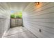 Covered patio with concrete floor and wood siding offers a private outdoor space at 1648 S Cole St # A2, Lakewood, CO 80228