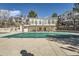 Relaxing pool area features a covered pool, manicured lawn, mature trees and plenty of room for activities at 1648 S Cole St # A2, Lakewood, CO 80228