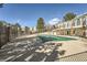 Community pool area offers a relaxing oasis with covered pool, mature trees, and well-maintained grounds at 1648 S Cole St # A2, Lakewood, CO 80228