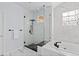 Sleek bathroom with glass enclosed shower, soaking tub, and modern fixtures at 5773 S Benton Way, Littleton, CO 80123