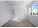 This bedroom offers a spacious layout, plush carpet, a closet, and plenty of natural light at 5773 S Benton Way, Littleton, CO 80123