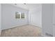 Neutral bedroom featuring large windows and ample closet space at 5773 S Benton Way, Littleton, CO 80123