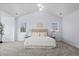 Bright bedroom with neutral decor, carpet, and large windows offering plenty of light at 5773 S Benton Way, Littleton, CO 80123
