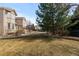 Well-manicured lawn and landscaped front yard compliment this two-story townhome with attached garage at 5773 S Benton Way, Littleton, CO 80123