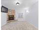 Bright living room with decorative stone fireplace at 5773 S Benton Way, Littleton, CO 80123