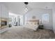 Spacious main bedroom featuring a fireplace, seating area, and large windows at 5773 S Benton Way, Littleton, CO 80123