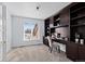 Bright office space with large window, built-in shelving and cabinetry at 5773 S Benton Way, Littleton, CO 80123