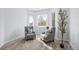 Sitting area featuring neutral decor, large windows, and carpeted floors at 5773 S Benton Way, Littleton, CO 80123