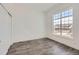 Bedroom with hardwood flooring and a large window at 651 Scrubjay Cir, Castle Rock, CO 80104