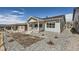 Charming single Gathering home with gray siding, white trim, and a landscaped yard at 651 Scrubjay Cir, Castle Rock, CO 80104