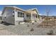 A view of the gray single-Gathering house with landscaping at 651 Scrubjay Cir, Castle Rock, CO 80104