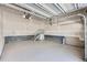 Large unfinished garage with painted walls and a concrete floor at 651 Scrubjay Cir, Castle Rock, CO 80104