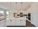 Modern kitchen with a large island, stainless steel appliances and lots of counter space at 651 Scrubjay Cir, Castle Rock, CO 80104