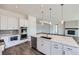 Modern kitchen featuring an island with marble countertop and stainless steel appliances at 651 Scrubjay Cir, Castle Rock, CO 80104