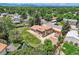 Spacious property with a well-maintained lawn and privacy fence, surrounded by lush trees and mountain views in the distance at 2380 W 105Th Pl, Northglenn, CO 80234