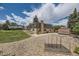Wide shot of backyard, featuring trees, garden area, and detached garage at 2380 W 105Th Pl, Northglenn, CO 80234