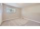 Bright bedroom showcasing neutral carpet and a window with blinds at 2380 W 105Th Pl, Northglenn, CO 80234