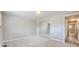 Carpeted bedroom with a mirrored closet at 2380 W 105Th Pl, Northglenn, CO 80234