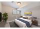 Serene bedroom featuring neutral colors, complemented by a large window, and a cozy ambiance at 2380 W 105Th Pl, Northglenn, CO 80234