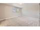 Spacious bedroom with a neutral color palette, plush carpeting, and a window at 2380 W 105Th Pl, Northglenn, CO 80234