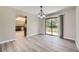 Open dining area with modern lighting and access to the backyard at 2380 W 105Th Pl, Northglenn, CO 80234