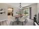 Dining room with table, chairs, and sliding glass door, offering a cozy and inviting atmosphere at 2380 W 105Th Pl, Northglenn, CO 80234