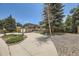 Two-story home with well-maintained landscaping including large trees and shrubbery at 2380 W 105Th Pl, Northglenn, CO 80234