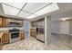 Bright kitchen with stainless steel appliances, oak cabinets, and tile flooring, providing modern style at 2380 W 105Th Pl, Northglenn, CO 80234