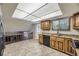 Kitchen featuring tile floors, granite counters, wood cabinets and stainless appliances at 2380 W 105Th Pl, Northglenn, CO 80234