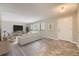 Staged living area with sofas, neutral decor, and large windows, showcasing comfortable and stylish living space at 2380 W 105Th Pl, Northglenn, CO 80234