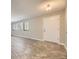 Bright entryway with tile flooring transitioning to hardwood flooring in the living room at 2380 W 105Th Pl, Northglenn, CO 80234